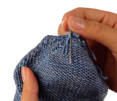 Wie man einen einfachen abgerundeten Zeh strickt